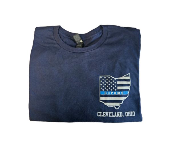 Folded navy memorial T-shirt showing the front design with a Thin Blue Line American flag inside the Ohio state outline, GCPOMS lettering, and “Cleveland, Ohio.”