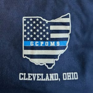Close-up of the Thin Blue Line Ohio flag design with GCPOMS and “Cleveland, Ohio” text on the front of the Honor Our Fallen T-shirt.